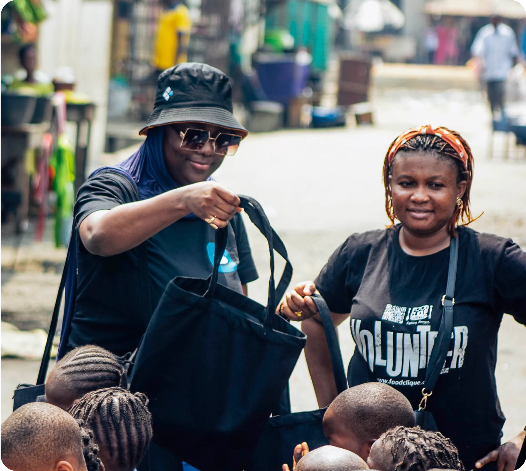 a woman handing a bag to a child